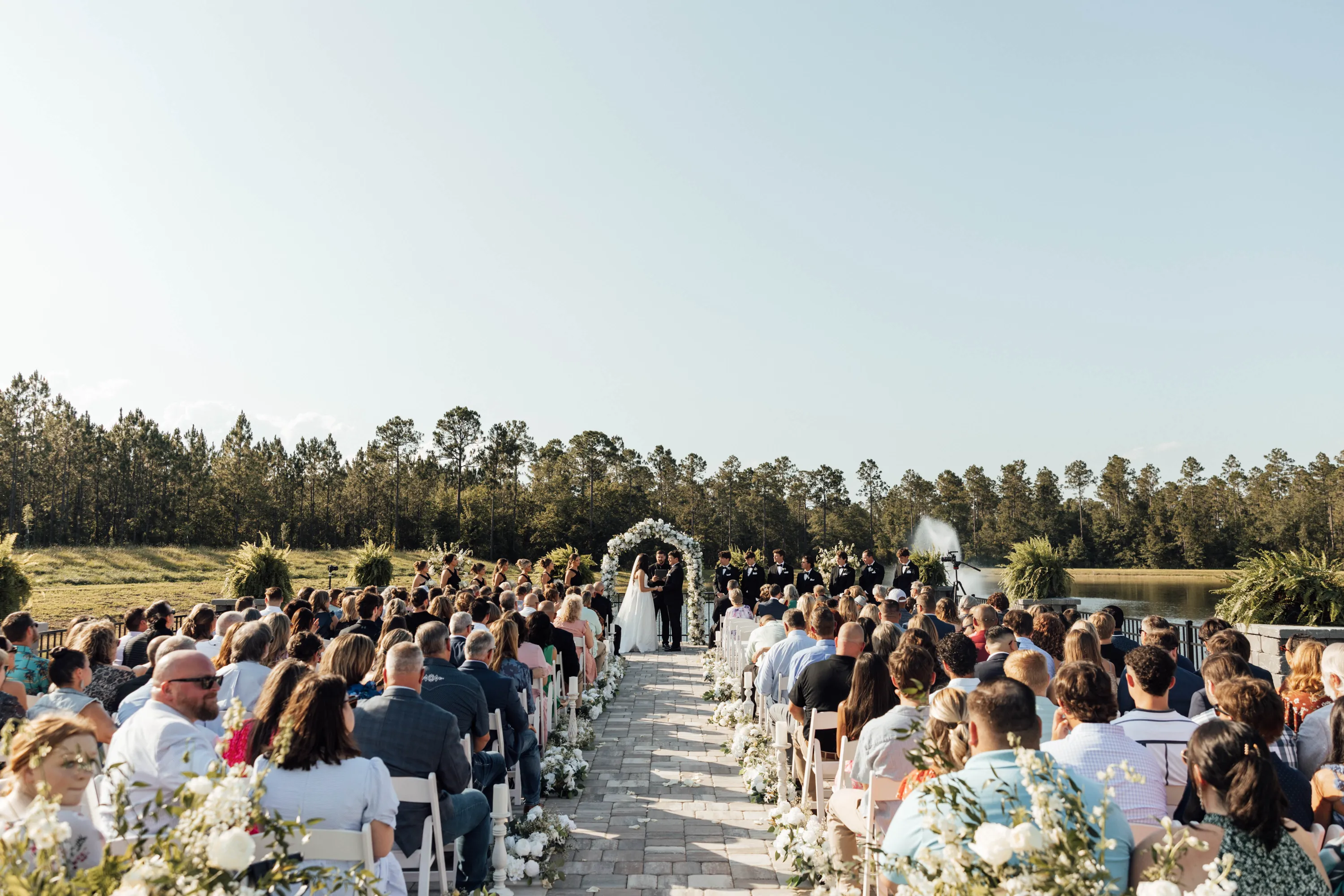 Wedding ceremony in progress at North Rail outdoor lakefront venue